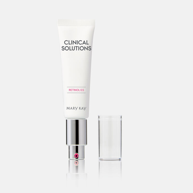 Tube of Mary Kay Clinical Solutions Retinol 0.5 standing on its pump with cap standing next to it