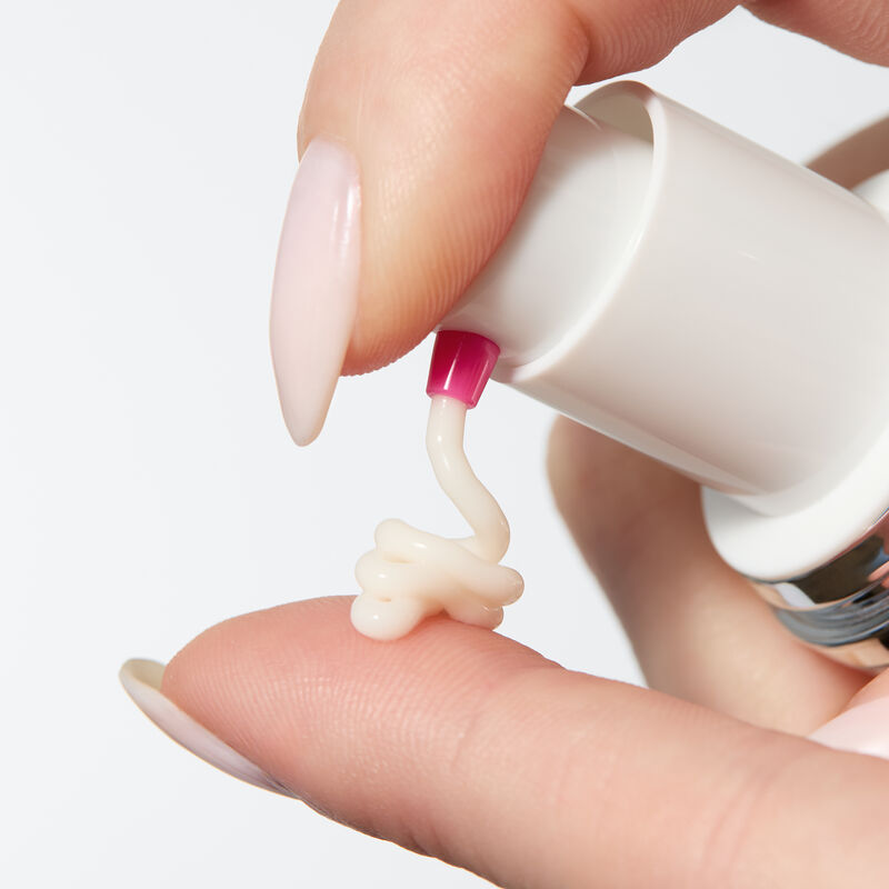 Hand pumping Mary Kay Clinical Solutions Barrier Restore 1:1:3 onto finger  image number null
