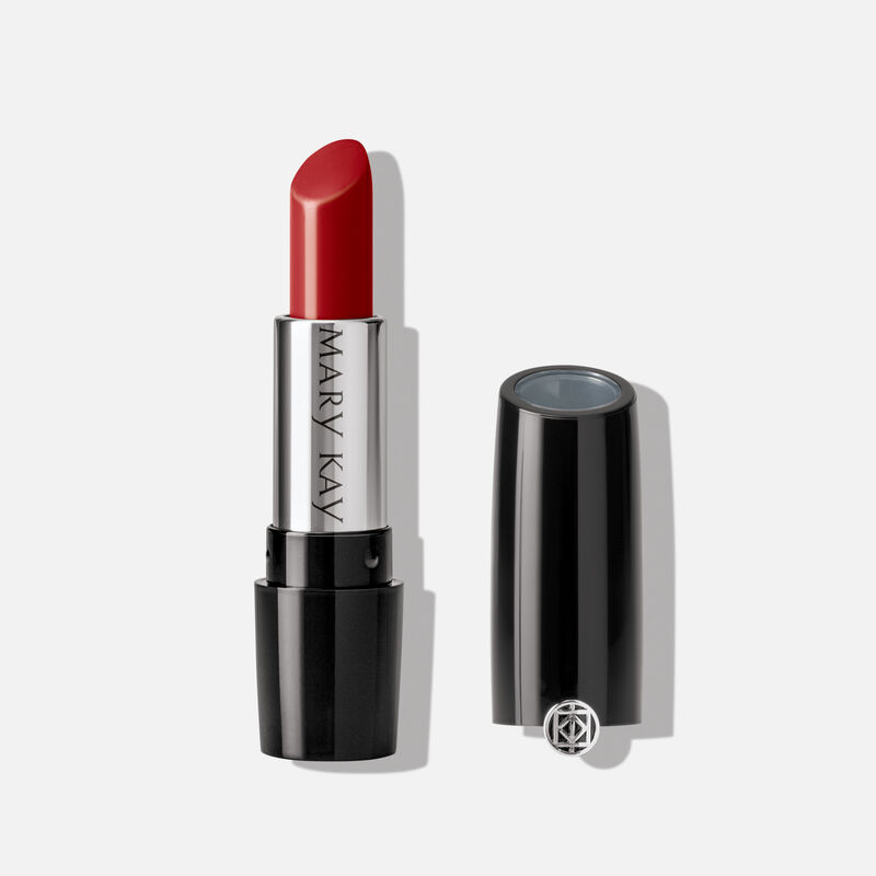 An open tube of Mary Kay Gel Semi-Shine Lipstick in the shade Red Smolder.