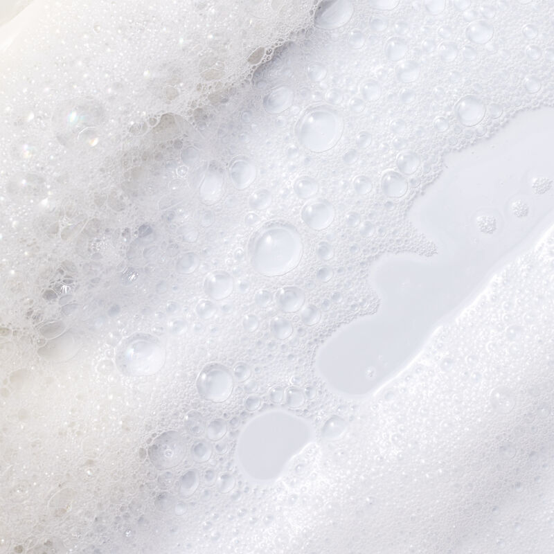 Close up displaying the sudsy texture of limited-edition Lavender & Coconut Mary Kay Shower Gel