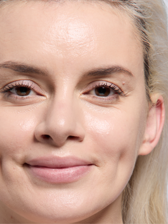Light skin tone model shown after applying foundation.