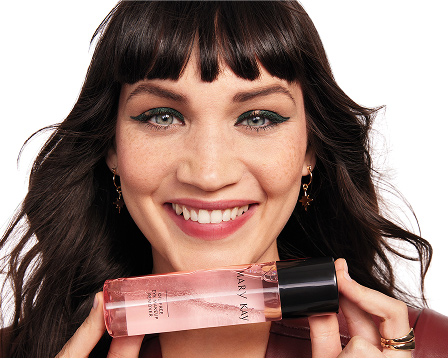 Female model holding Mary Kay Eye Makeup Remover to her face