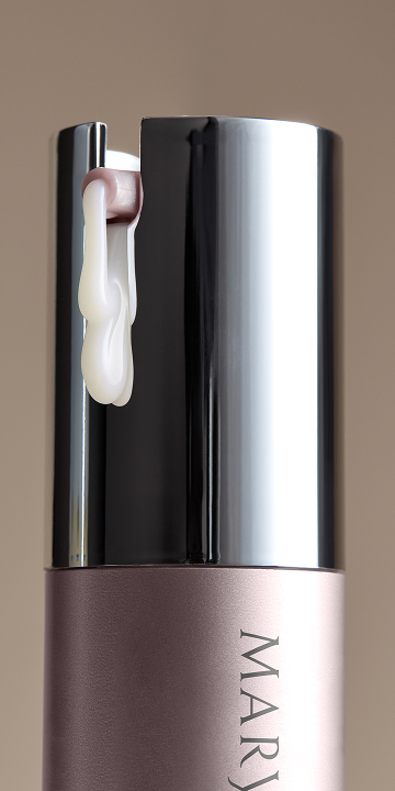 A close up of a woman's face with eye cream.